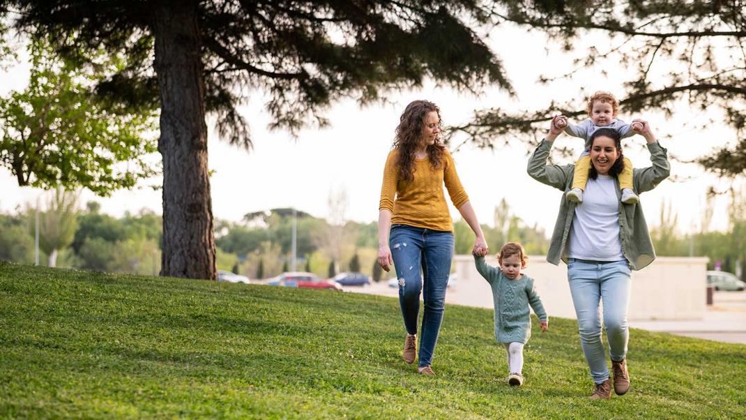 Mothers outside in park with their children
